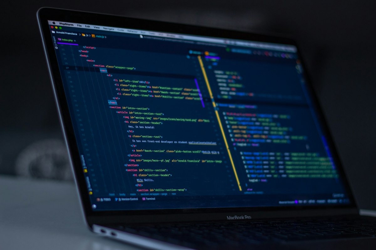 A screen filled with colorful source code in a dark editor