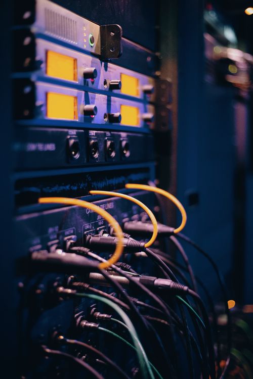Ethernet cables plugged into a server rack in a data center, showing network connectivity infrastructure