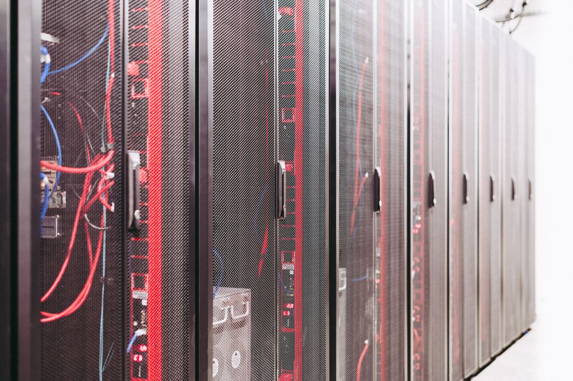 Server racks with status lights in a modern data center facility