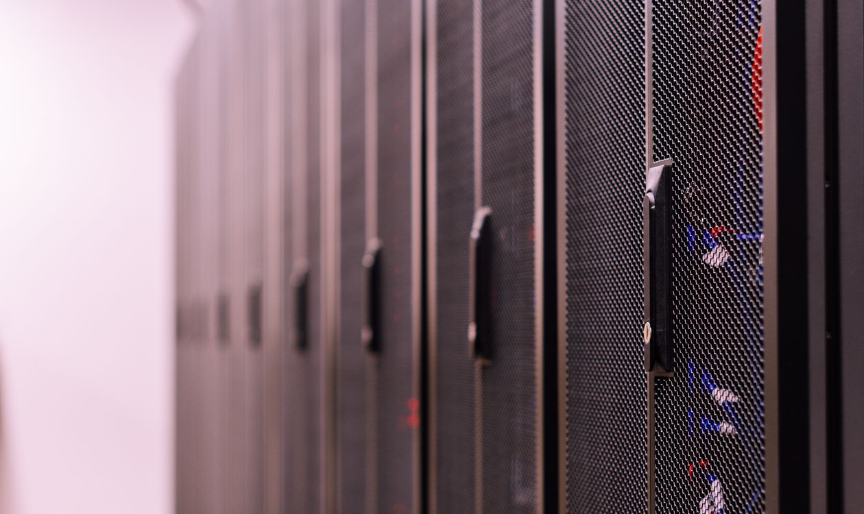 Black server racks with cable management in a professional data center environment